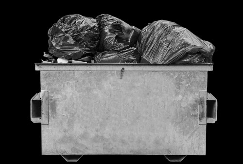 Staff assisting a business client with waste removal arrangements